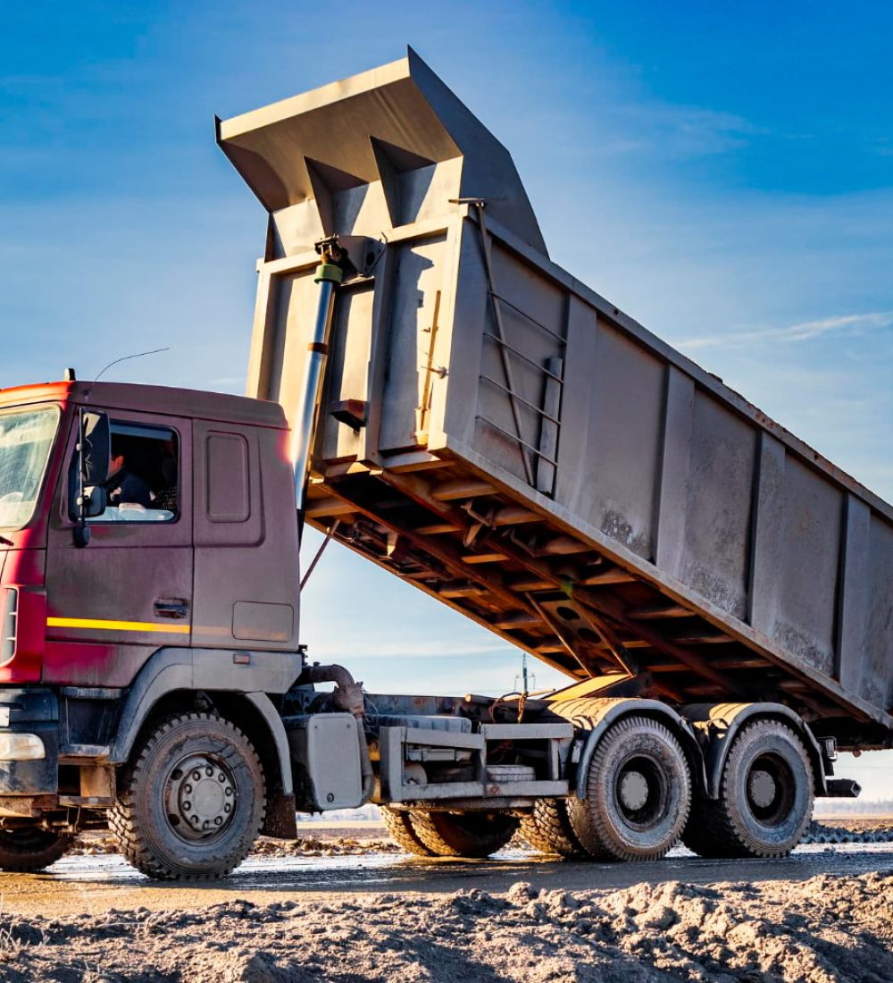 dump-truck-with-raised-body-construction-site-process-transportation-unloading-soil-technique-transportation-bulky-materials-rental-construction-equipment