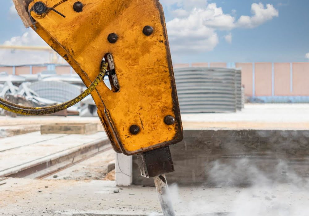 professional-demolition-reinforced-concrete-structures-with-industrial-hydraulic-hammer-with-excavator-dismantling-concrete-floor-production-area-debris-crumbs-concrete